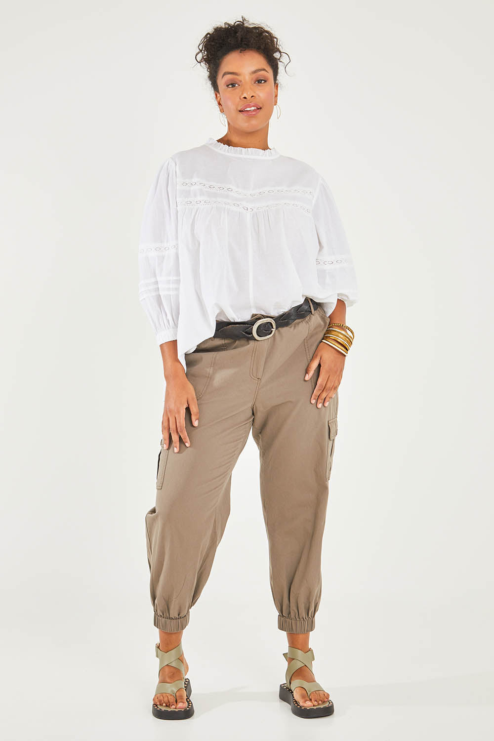Model Noli wearing size 14 of the Travel With You Cargo Pants in colour Castle, from the front, showing the whole outfit