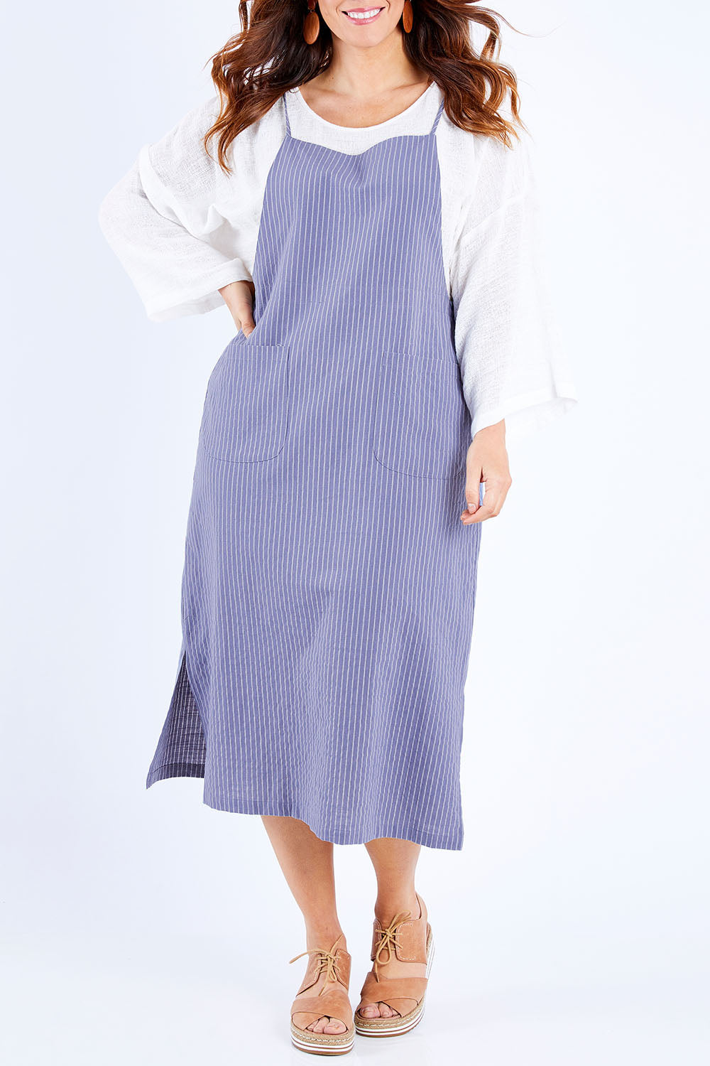 Model Laura wearing size 14 of the Thats The Way I Like It Pinny Dress in colour Denim (Blue), from the front, cropped image
