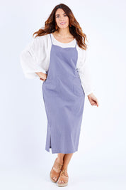 Model Laura wearing size 14 of the Thats The Way I Like It Pinny Dress in colour Denim (Blue), from the front, showing the whole outfit