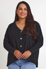 Model Ashleigh wearing size 16 of the My Boyfriends Slouch Cardi in colour Black (Black), from the front, cropped image