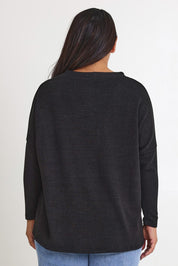 Model Ashleigh wearing size 16 of the My Boyfriends Slouch Cardi in colour Black (Black), from the front, cropped image