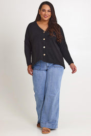 Model Ashleigh wearing size 16 of the My Boyfriends Slouch Cardi in colour Black (Black), from the front, showing the whole outfit