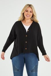 Model Katie wearing size 16 of the My Boyfriends Slouch Cardi in colour Black (Black), from the front, cropped image