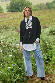 Model Tegan wearing size 10 of the My Boyfriends Slouch Cardi in colour Black (Black), from the front, showing the whole outfit