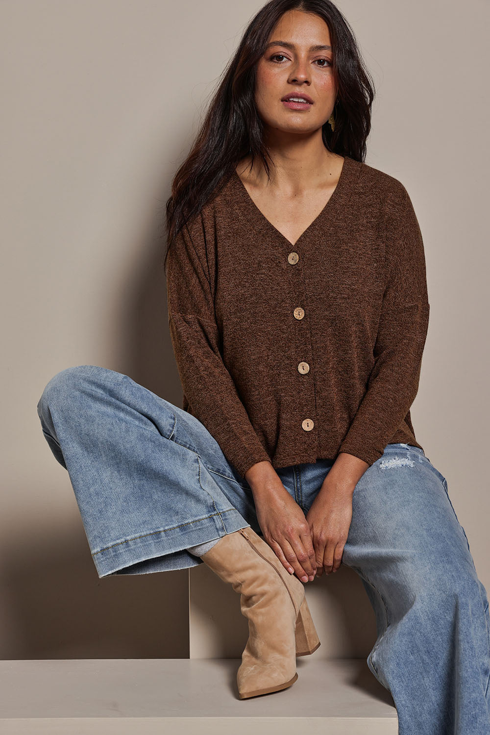 Model Tahnee wearing size 10 of the My Boyfriends Slouch Cardi in colour Chocolate, from the front, cropped image