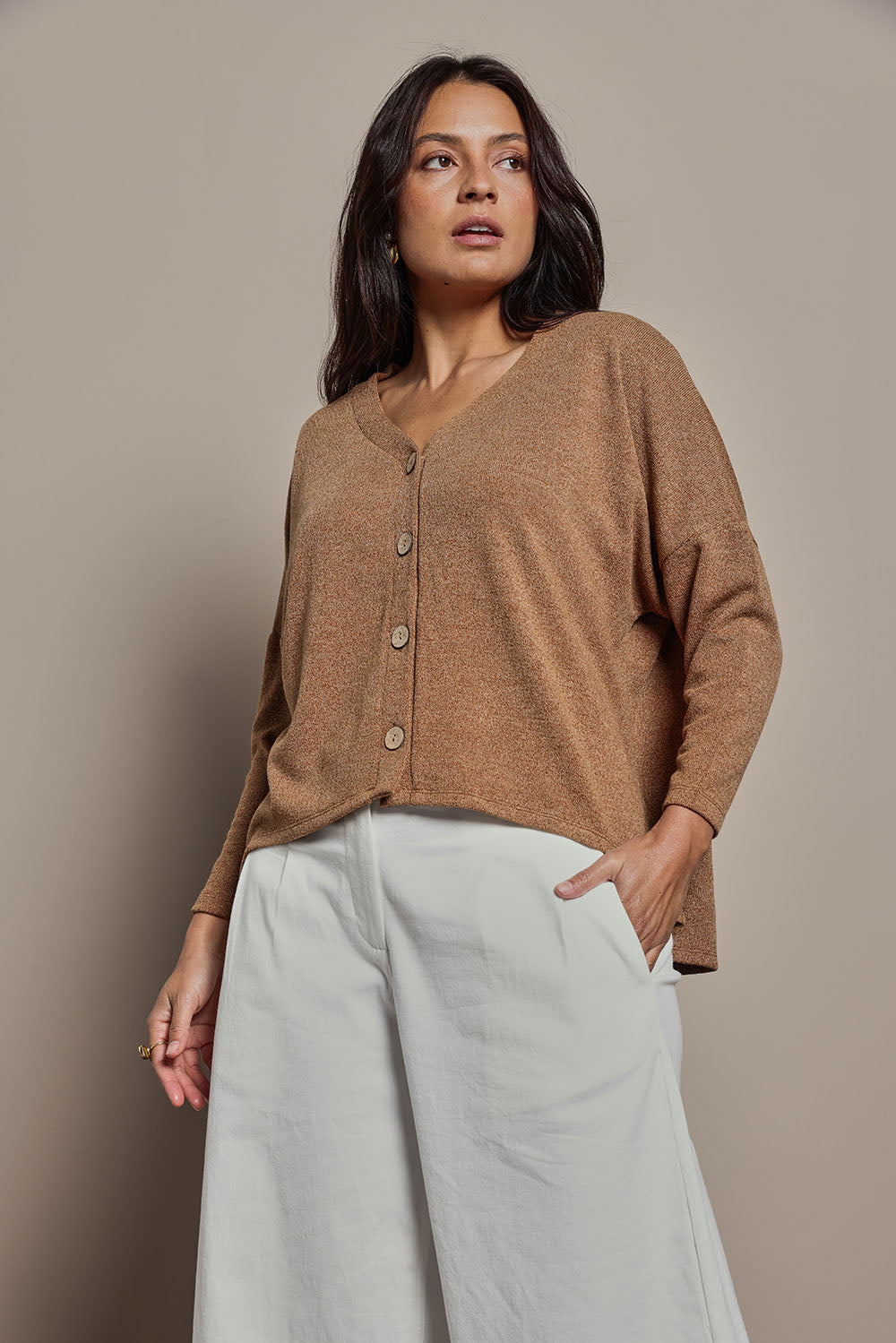 Model Tahnee wearing size 10 of the My Boyfriends Slouch Cardi in colour Coffee, from the front, cropped image