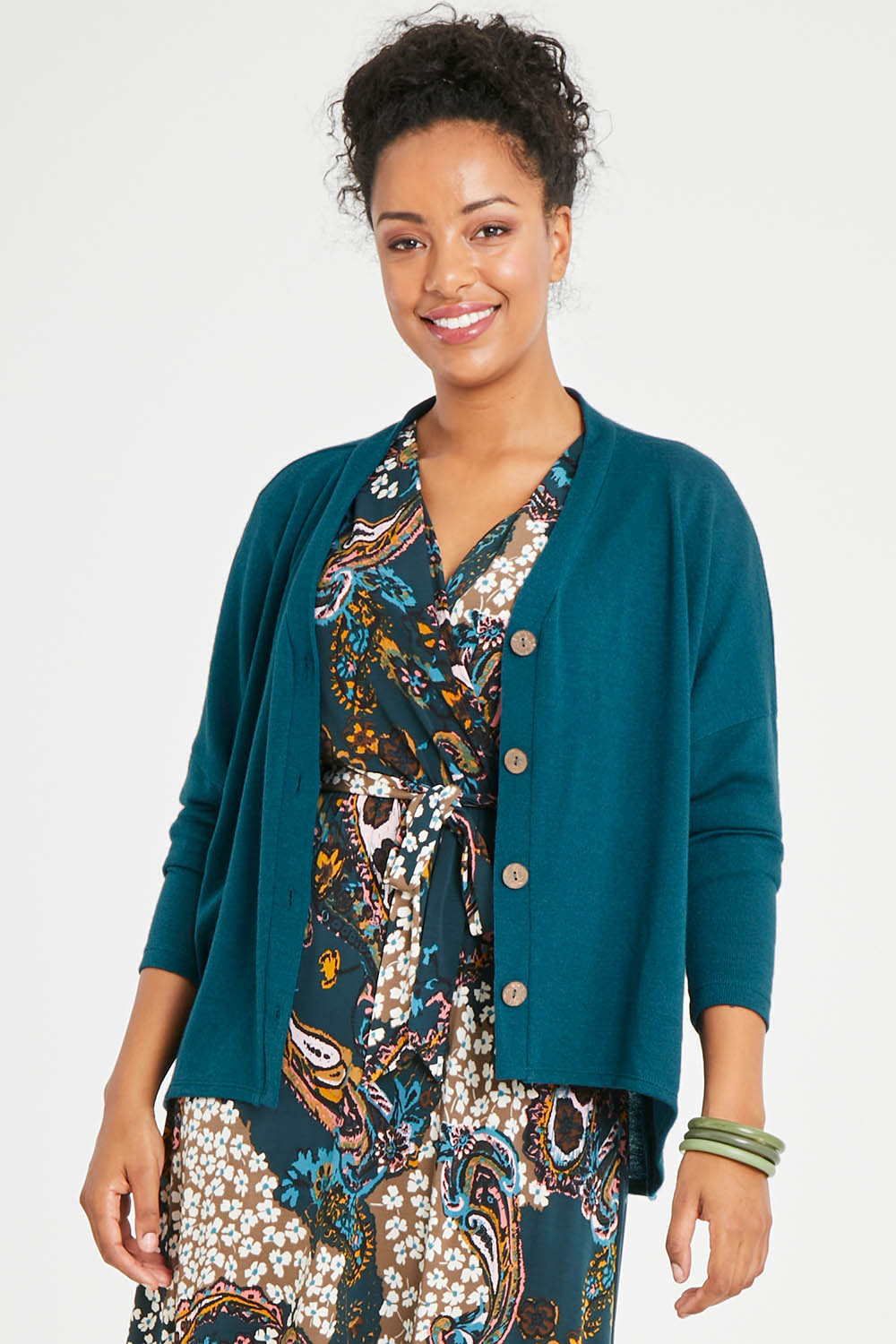 Model Noli wearing size 14 of the My Boyfriends Slouch Cardi in colour Deepteal (Blue), from the front, cropped image