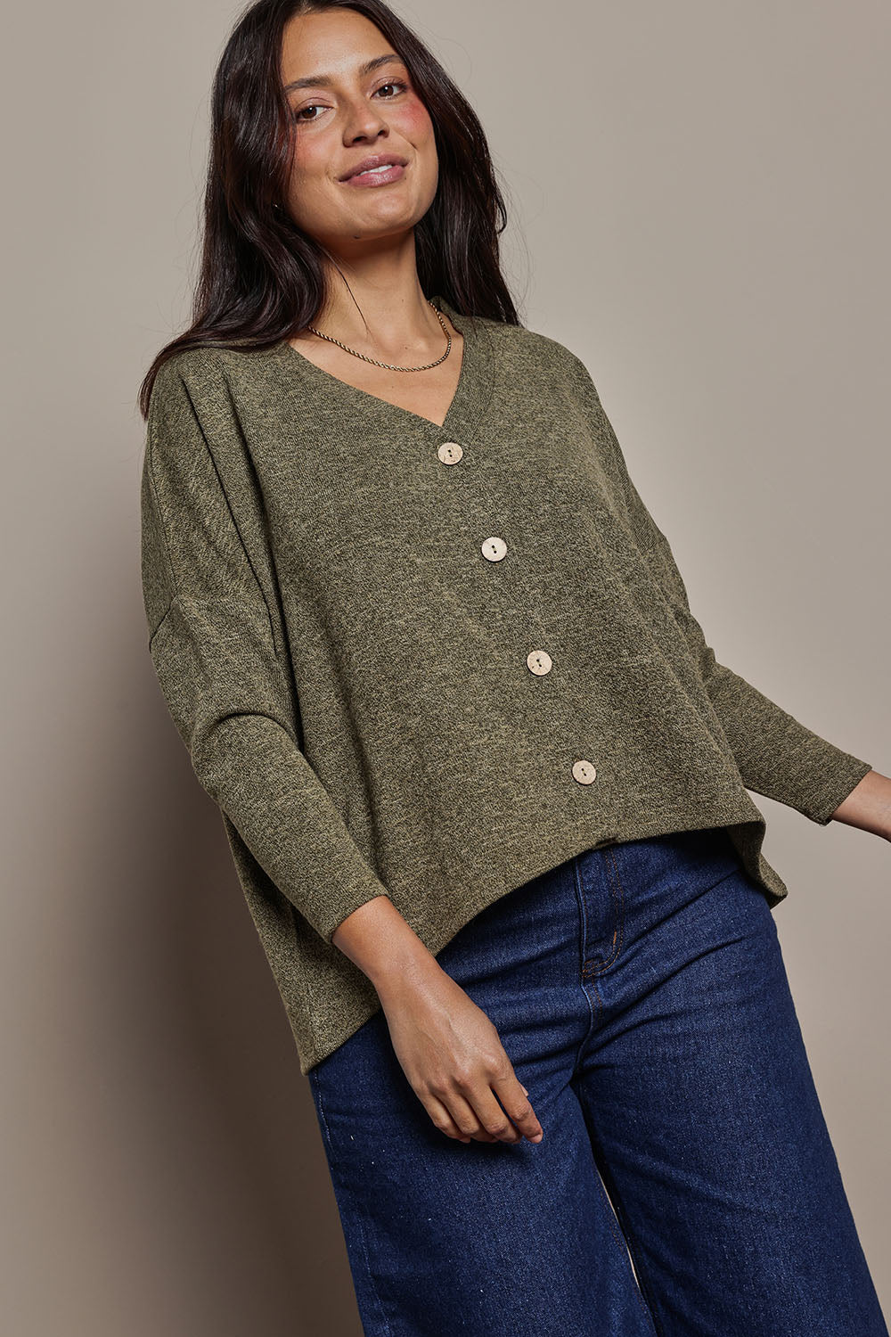 Model Tahnee wearing size 10 of the My Boyfriends Slouch Cardi in colour Gum (Green), from the front, cropped image