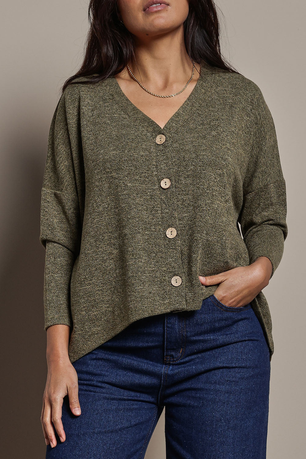 Model Tahnee wearing size 10 of the My Boyfriends Slouch Cardi in colour Gum (Green), from the front, cropped image