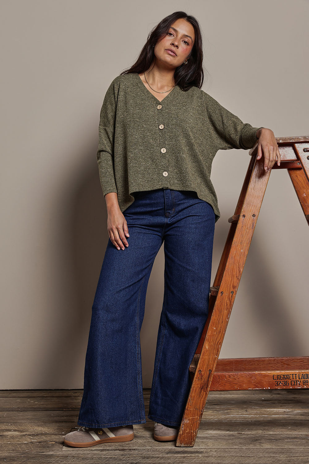 Model Tahnee wearing size 10 of the My Boyfriends Slouch Cardi in colour Gum (Green), from the front, showing the whole outfit