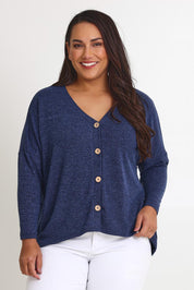 Model Ashleigh wearing size 16 of the My Boyfriends Slouch Cardi in colour Indigo (Blue), from the front, cropped image