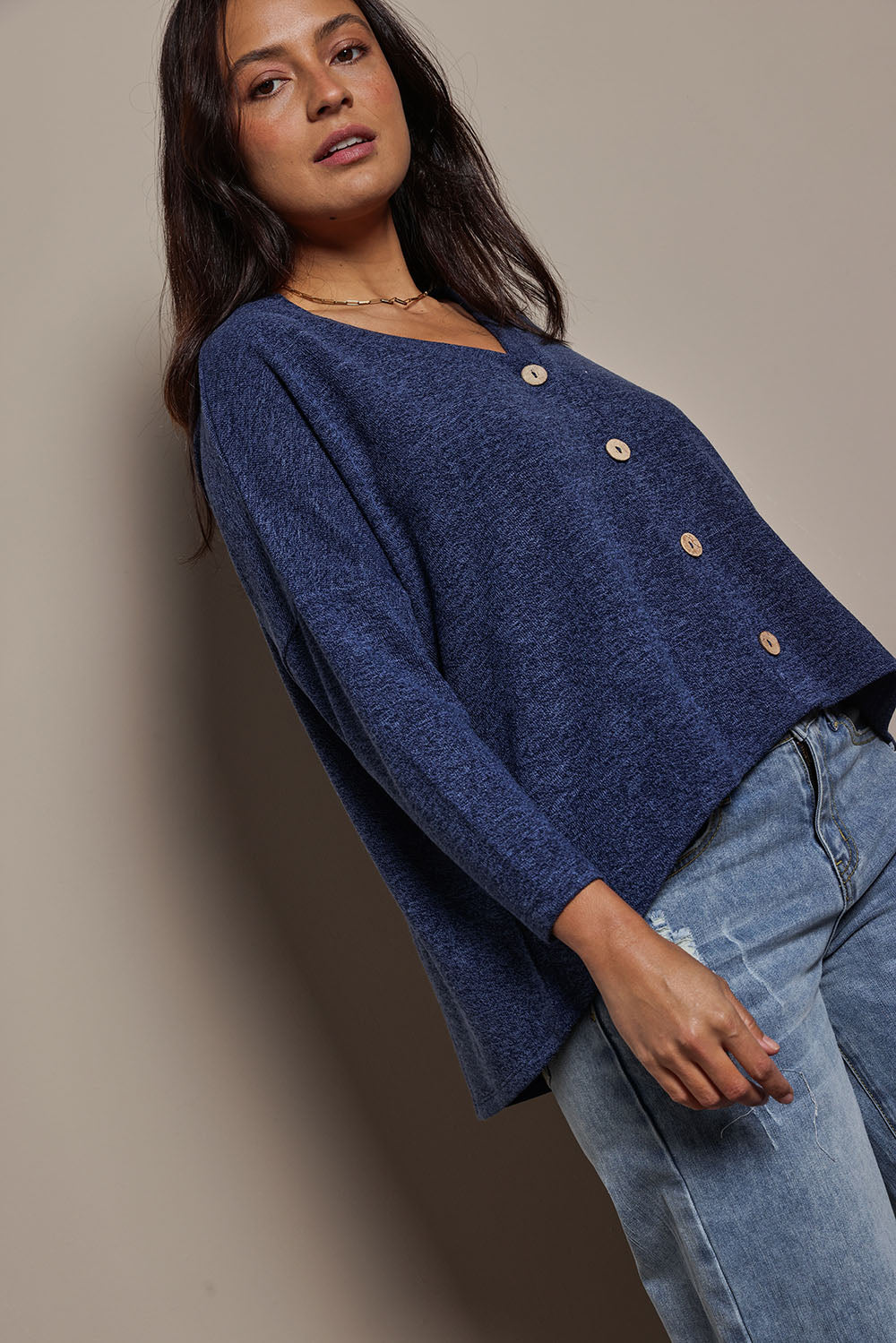 Model Tahnee wearing size 10 of the My Boyfriends Slouch Cardi in colour Indigo (Blue), from the front, cropped image