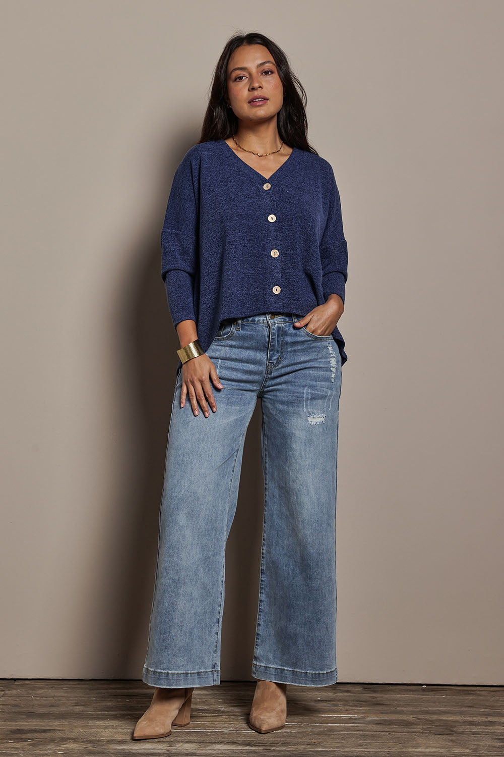 Model Tahnee wearing size 10 of the My Boyfriends Slouch Cardi in colour Indigo (Blue), from the front, showing the whole outfit