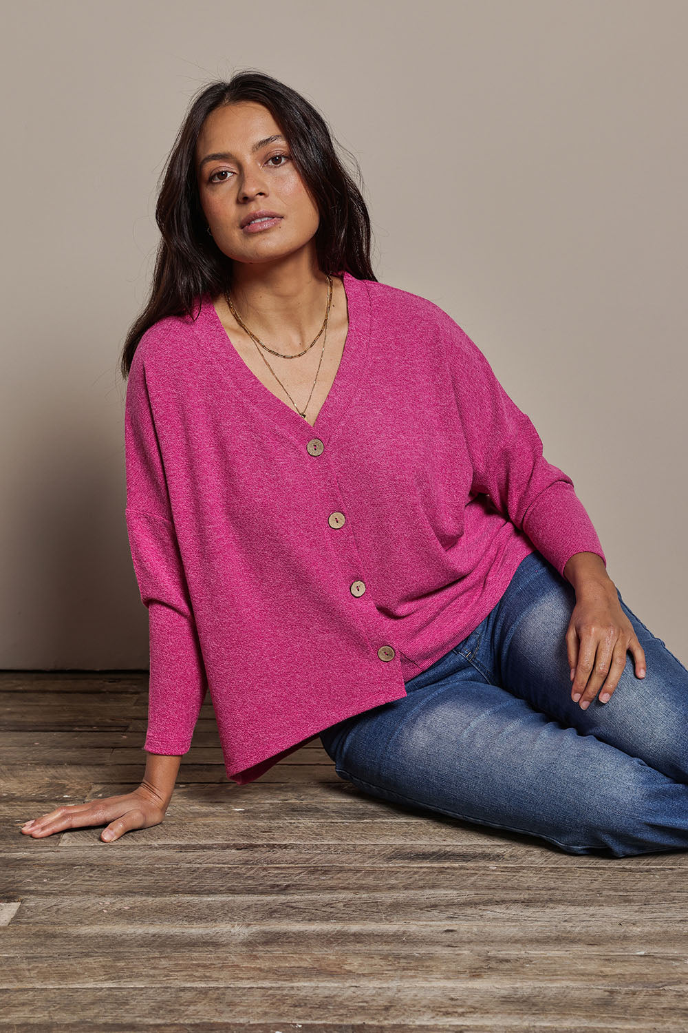 Model Tahnee wearing size 10 of the My Boyfriends Slouch Cardi in colour Magenta (Pink), from the front, cropped image