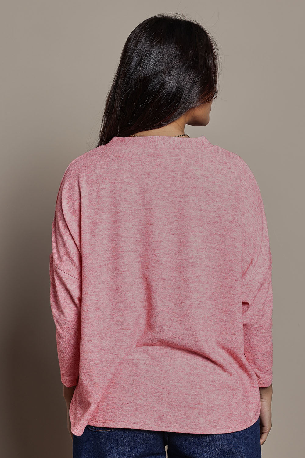 Model Tahnee wearing size 10 of the My Boyfriends Slouch Cardi in colour Pinkmarl (Pink), from the back