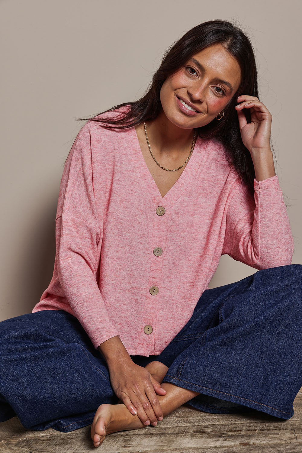 Model Tahnee wearing size 10 of the My Boyfriends Slouch Cardi in colour Pinkmarl (Pink), from the front, showing the whole outfit