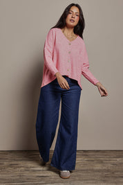 Model Tahnee wearing size 10 of the My Boyfriends Slouch Cardi in colour Pinkmarl (Pink), from the front, showing the whole outfit