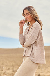 Model Amelia wearing size 10 of the My Boyfriends Slouch Cardi in colour Sandmarl, from the front, showing the whole outfit