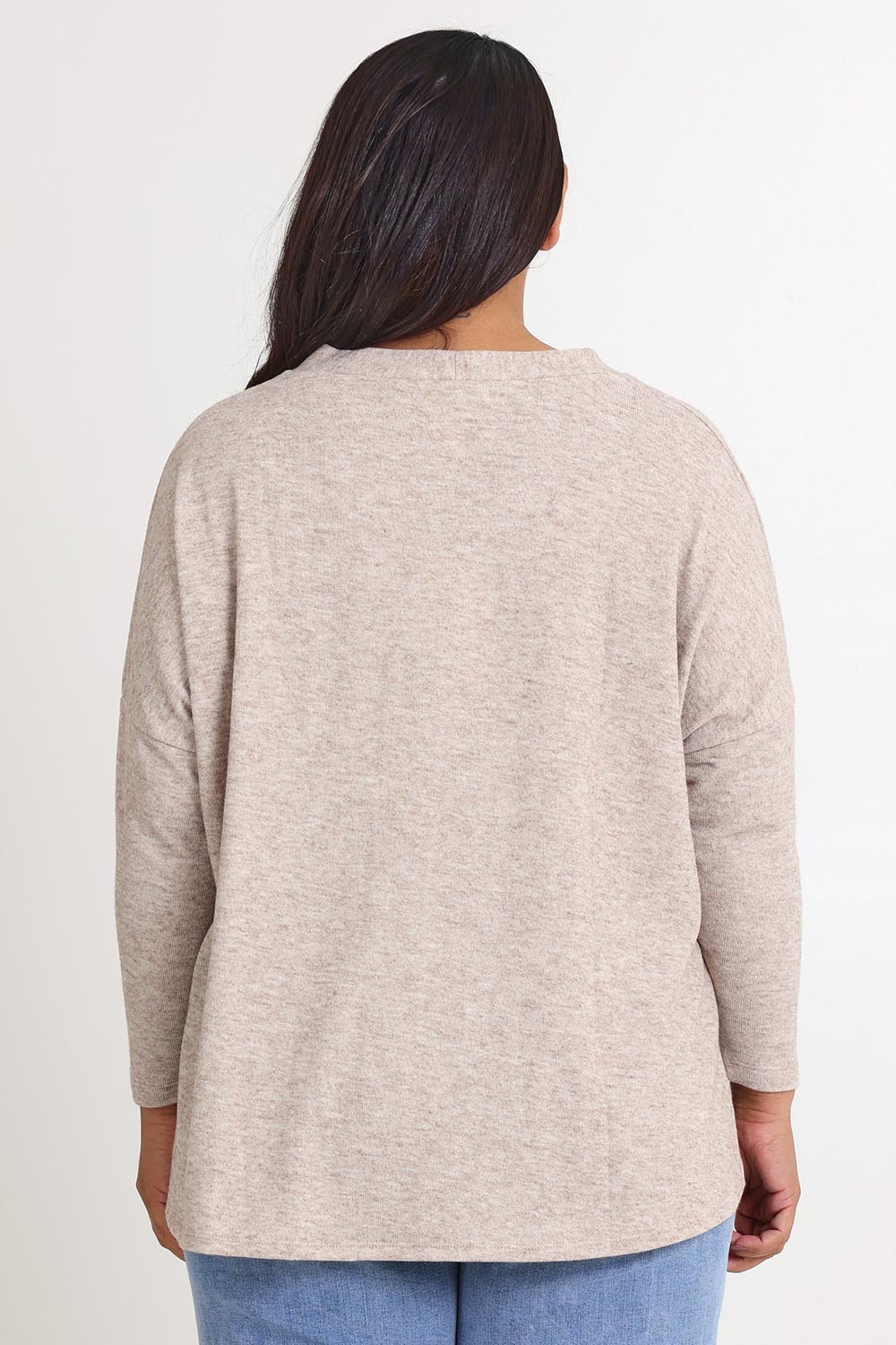Model Ashleigh wearing size 16 of the My Boyfriends Slouch Cardi in colour Sandmarl, from the back