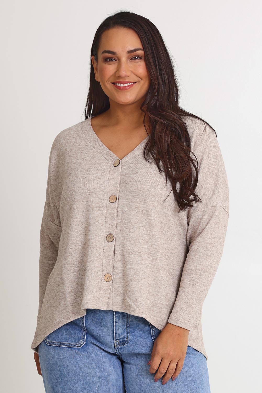 Model Ashleigh wearing size 16 of the My Boyfriends Slouch Cardi in colour Sandmarl, from the front, cropped image