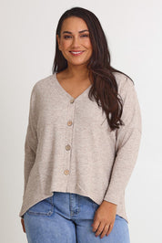 Model Ashleigh wearing size 16 of the My Boyfriends Slouch Cardi in colour Sandmarl, from the front, cropped image