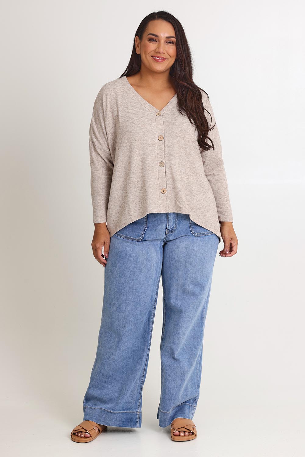 Model Ashleigh wearing size 16 of the My Boyfriends Slouch Cardi in colour Sandmarl, from the front, showing the whole outfit