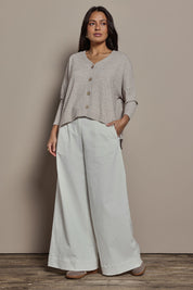 Model Tahnee wearing size 10 of the My Boyfriends Slouch Cardi in colour Sandmarl, from the front, showing the whole outfit