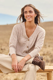 Model Tegan wearing size 10 of the My Boyfriends Slouch Cardi in colour Sandmarl, from the front, showing the whole outfit