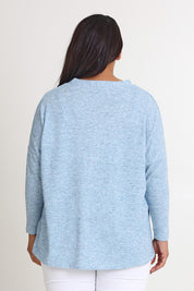 Model Ashleigh wearing size 16 of the My Boyfriends Slouch Cardi in colour Skymarl (Blue), from the back