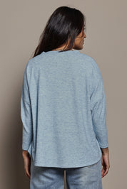 Model Tahnee wearing size 10 of the My Boyfriends Slouch Cardi in colour Skymarl (Blue), from the back