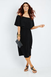 Model Laura wearing size 14 of The Wanderer In Me Off Shoulder Travel Dress in colour Black (Black), from the front, showing the whole outfit