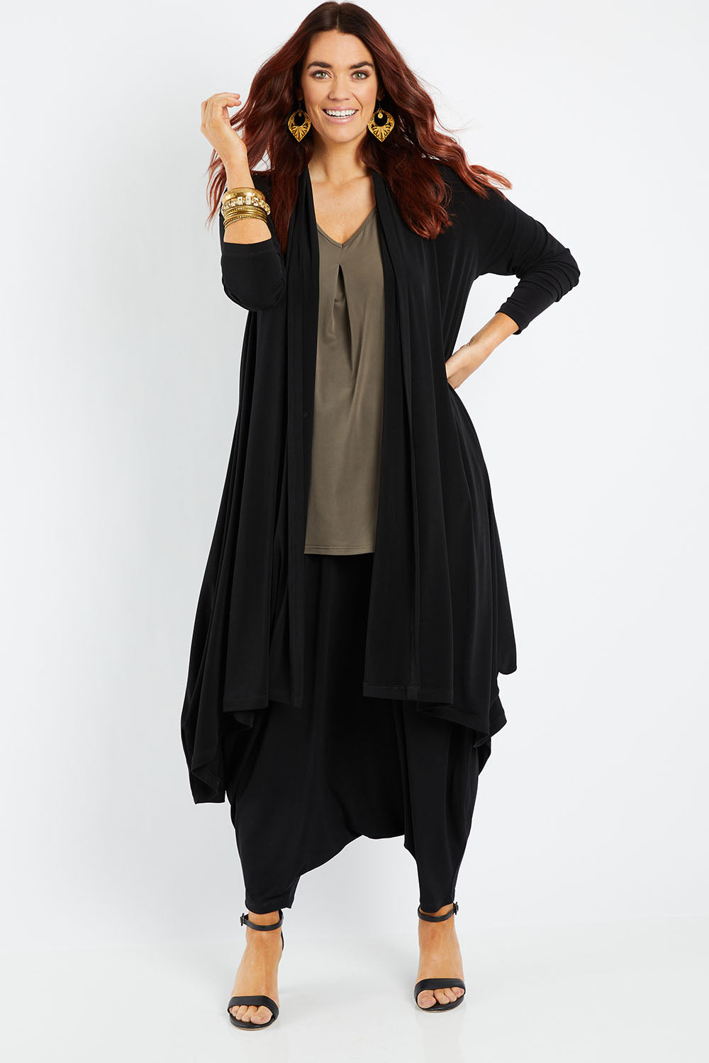 Model Laura wearing size 14 of The Wanderer In Me Swing Travel Cardi in colour Black (Black), from the front, showing the whole outfit