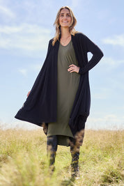 Model Tegan wearing size 10 of The Wanderer In Me Swing Travel Cardi in colour Black (Black), from the front, showing the whole outfit