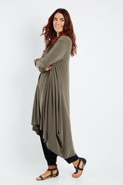 Model Laura wearing size 14 of The Wanderer In Me Swing Travel Cardi in colour Khaki (Green), from the front, showing the whole outfit