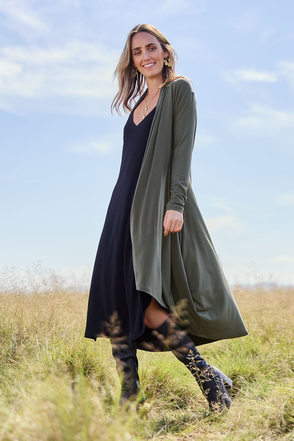 Model Tegan wearing size 10 of The Wanderer In Me Swing Travel Cardi in colour Khaki (Green), from the front, showing the whole outfit