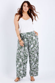 Model Laura wearing size 14 of the Flowers For Me Pants in colour Leaf (Green), from the front, showing the whole outfit