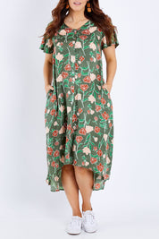 Model Laura wearing size 14 of the My Heart Is Full Dress in colour Khaki (Green), from the front, cropped image