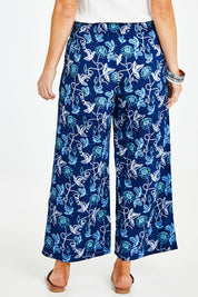 Model Laura wearing size 14 of the My Heart Is Full Flower Pants in colour Deepblue (Blue), from the back