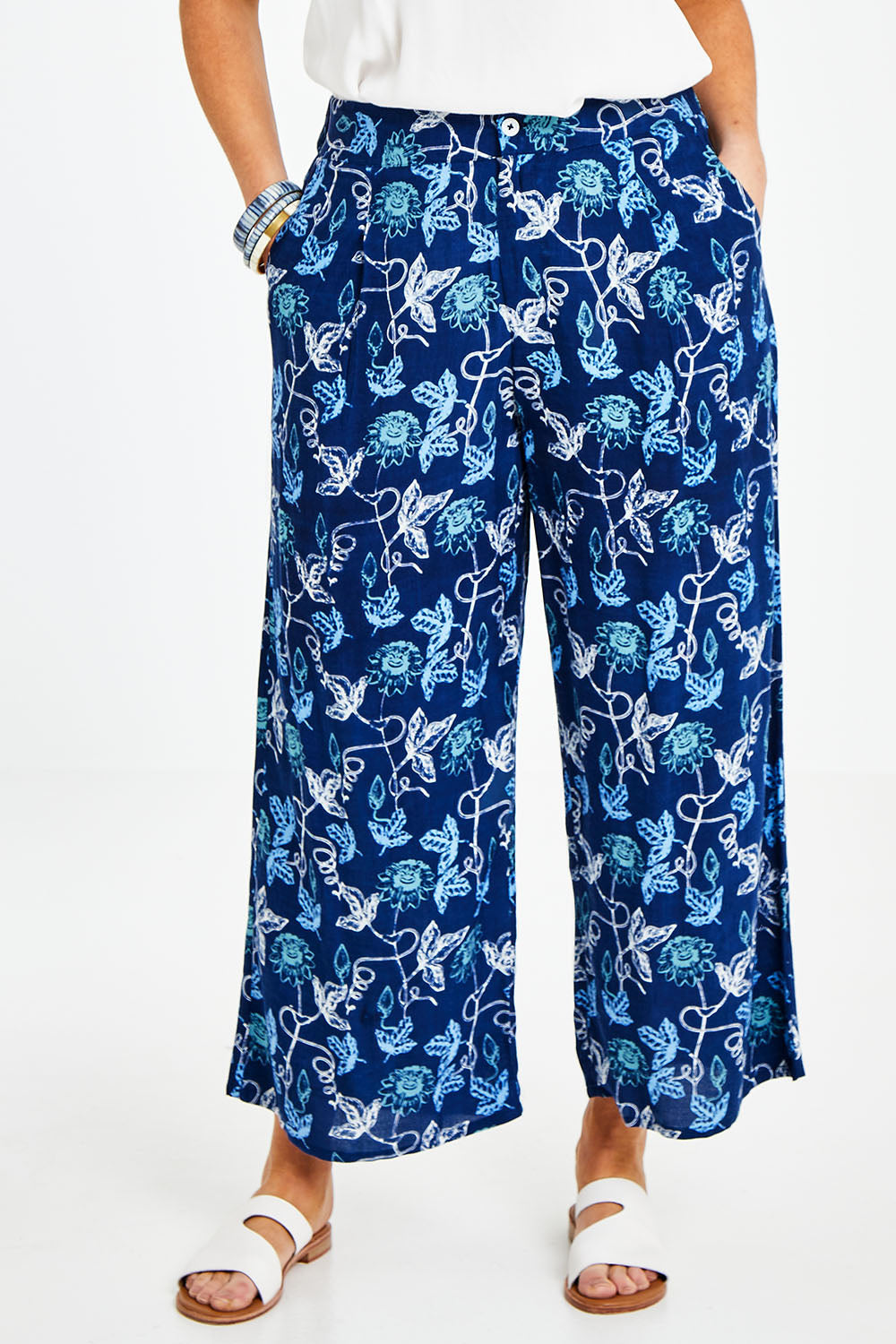 Model Laura wearing size 14 of the My Heart Is Full Flower Pants in colour Deepblue (Blue), from the front, cropped image