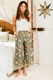 Model Ilona wearing size 10 of the My Heart Is Full Flower Pants in colour Khaki (Green), from the front, showing the whole outfit