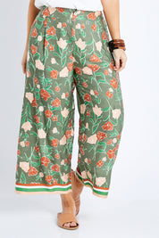 Model Laura wearing size 14 of the My Heart Is Full Flower Pants in colour Khaki (Green), from the front, cropped image