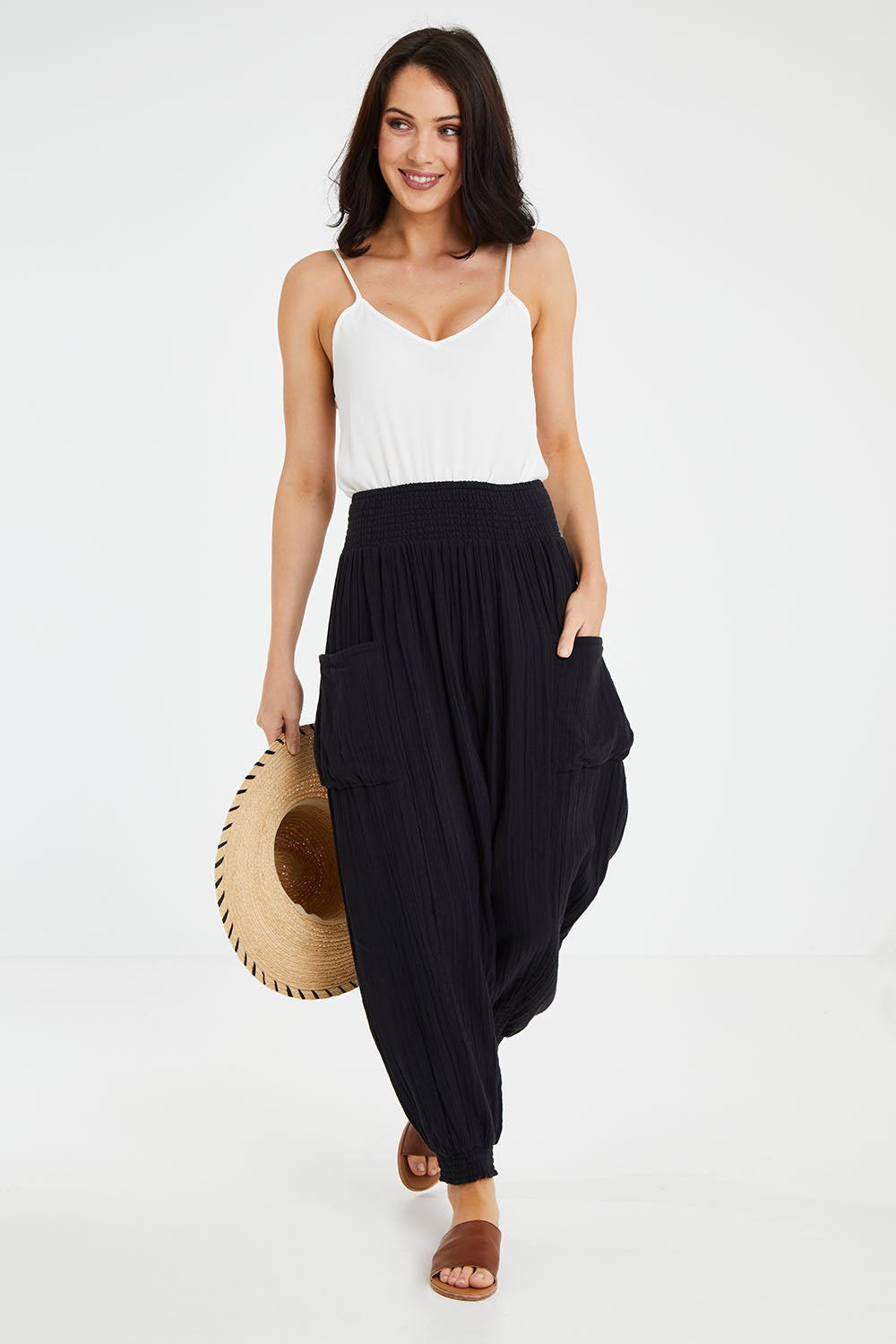 Model Andrea wearing size 10 of the Beach Breeze Cotton Slouch Pants in colour Black (Black), from the front, showing the whole outfit