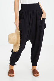 Model Andrea wearing size 10 of the Beach Breeze Cotton Slouch Pants in colour Black (Black), from the front, showing the whole outfit