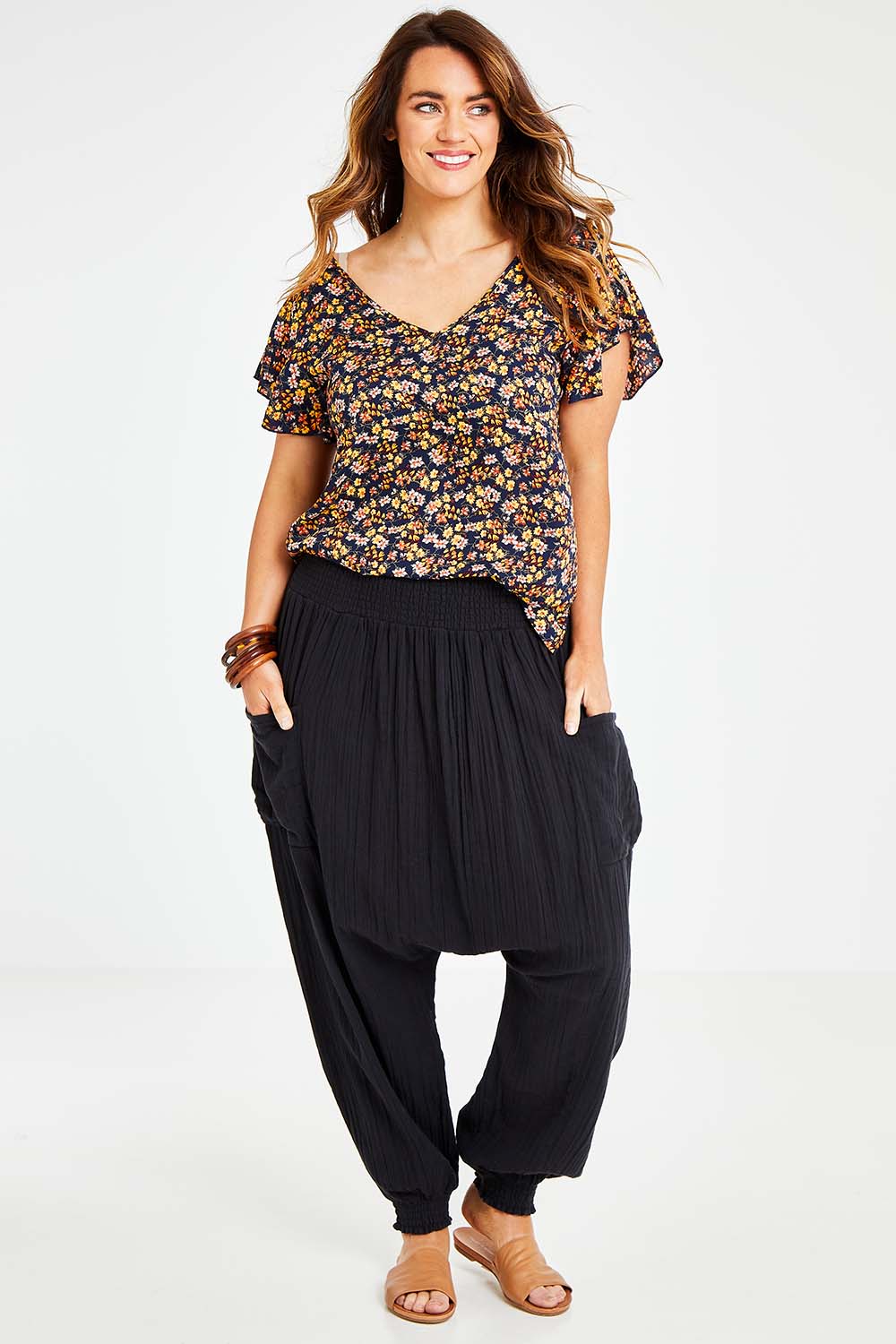 Model Laura wearing size 14 of the Beach Breeze Cotton Slouch Pants in colour Black (Black), from the front, showing the whole outfit