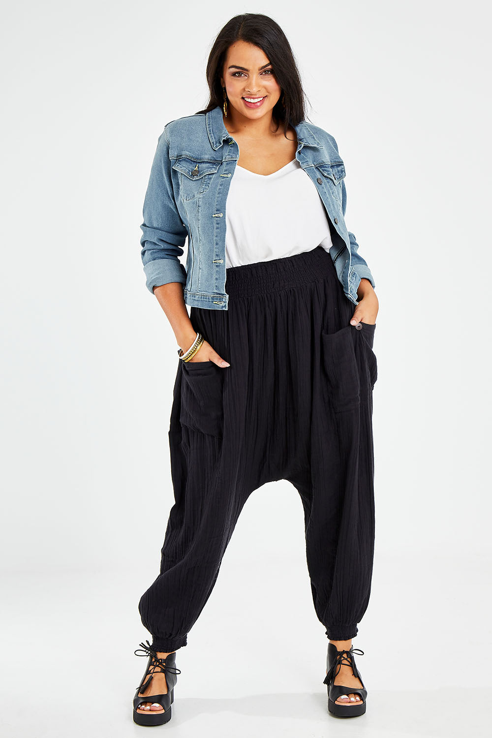 Model Sasha-Lee wearing size 16 of the Beach Breeze Cotton Slouch Pants in colour Black (Black), from the front, showing the whole outfit