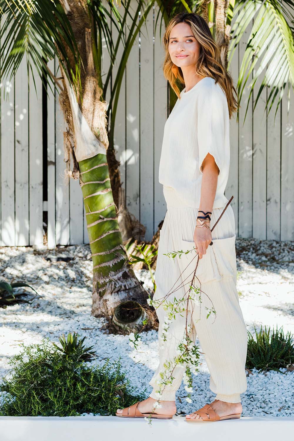 Model Ilona wearing size 10 of the Beach Breeze Cotton Slouch Pants in colour Wheat, from the front, showing the whole outfit