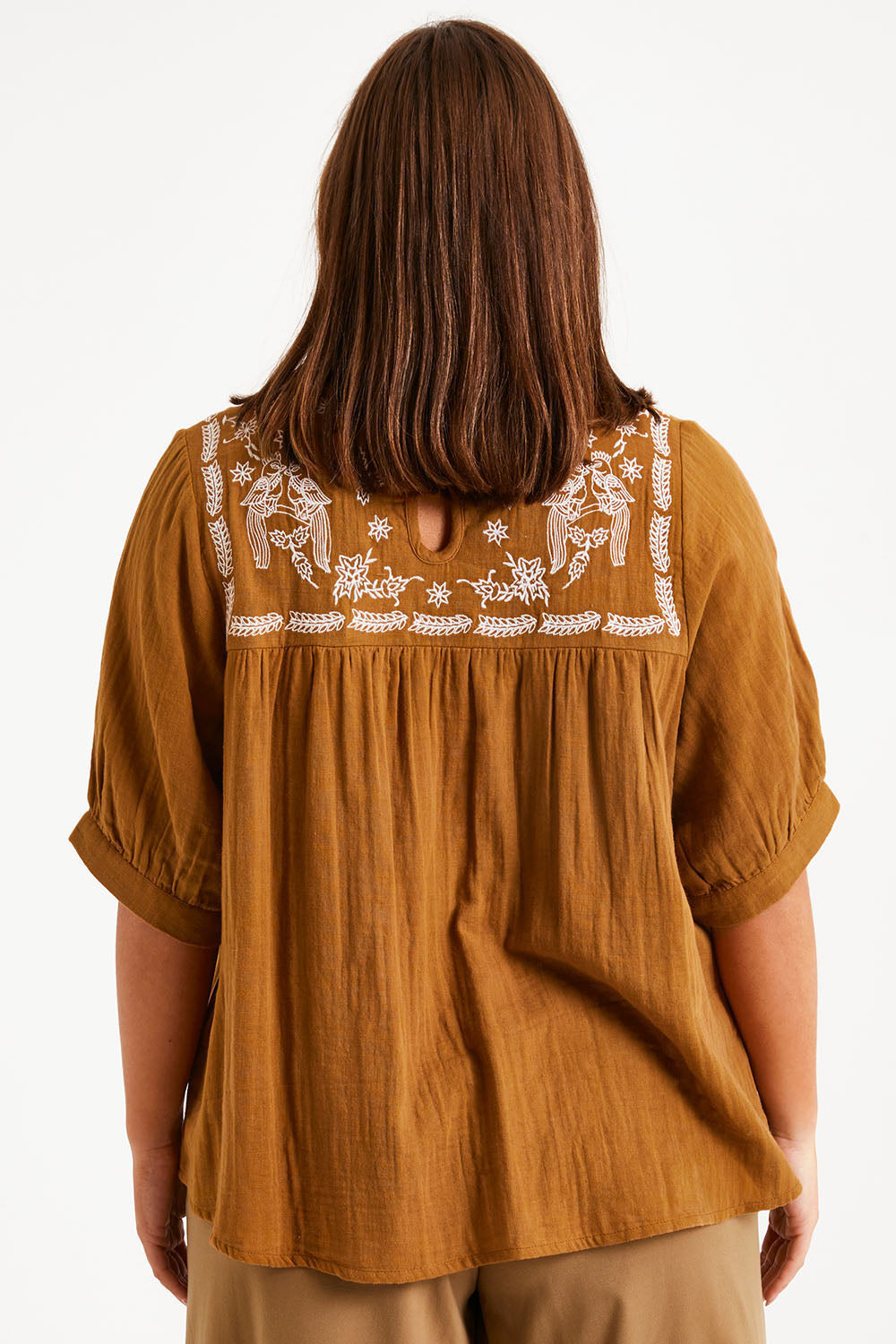 Model Monique wearing size 14 of the Secret Garden Cotton Blouse in colour Clay, from the back
