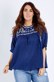Model Laura wearing size 14 of the Secret Garden Cotton Blouse in colour Deepblue (Blue), from the front, cropped image