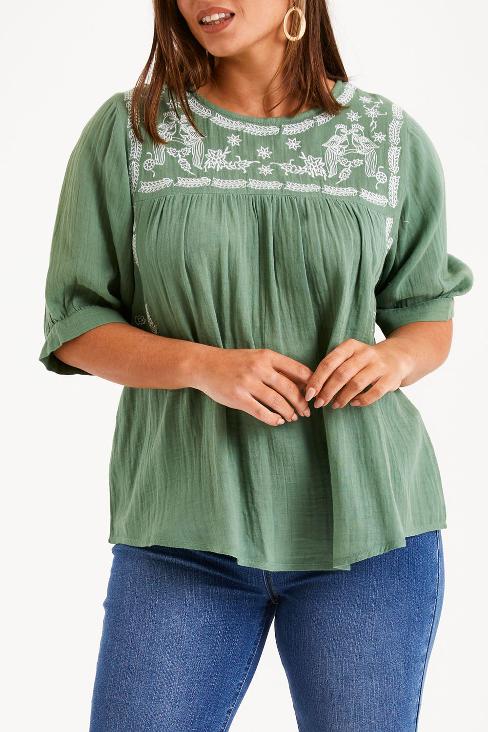 Model Monique wearing size 14 of the Secret Garden Cotton Blouse in colour Olive (Green), from the front, cropped image