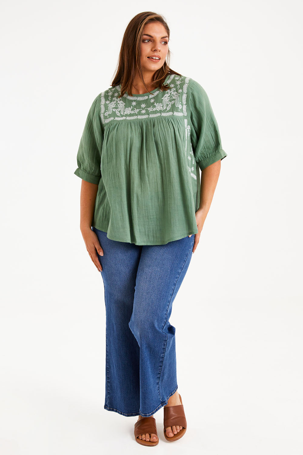 Model Monique wearing size 14 of the Secret Garden Cotton Blouse in colour Olive (Green), from the front, showing the whole outfit